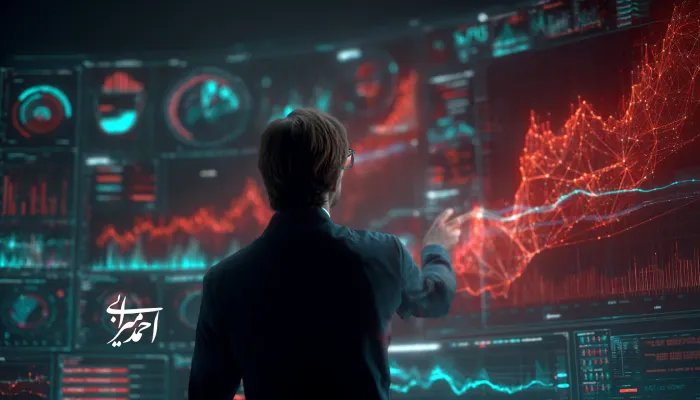 تحلیلگر داده در حال بررسی نمودارهای دیجیتال سه‌بعدی و داده‌های بزرگ روی صفحه‌ای پیشرفته با رنگ‌های قرمز و آبی؛ نمادی از نقش هوش مصنوعی در تحلیل بازار و تصمیم‌گیری‌های هوشمند.