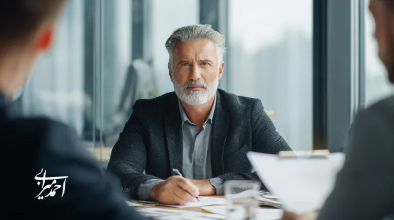 Iranian manager in a business meeting comparing coaching and mentoring approaches for managerial development and higher productivity