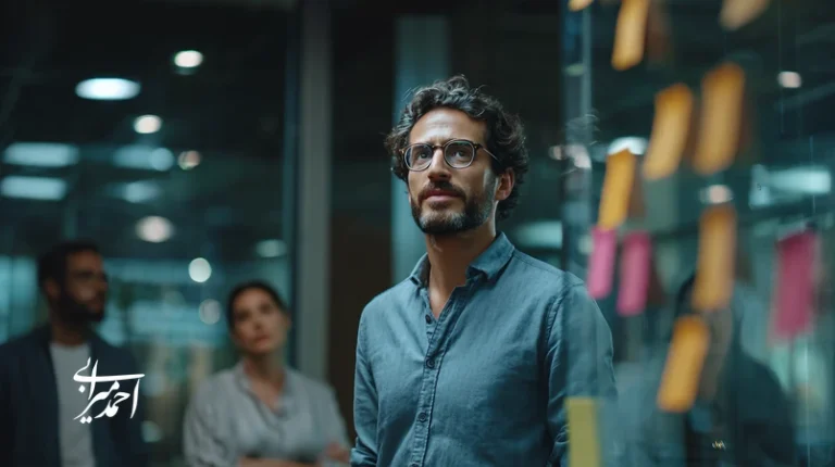 Iranian new manager in a modern office reviewing a 90-day performance roadmap with team during executive coaching for managers