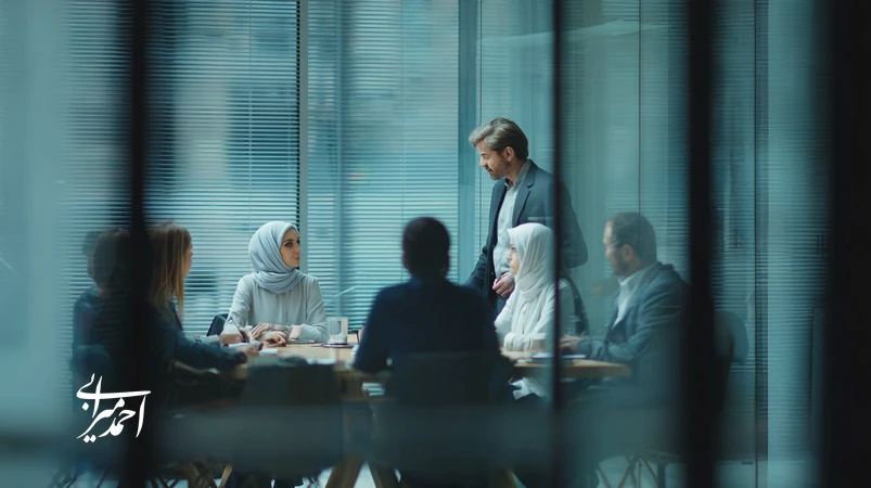 executive coaching helping an Iranian manager build a stronger, high-performance team through collaborative discussion in a modern office
