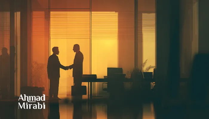 Business meeting handshake in a modern glass-walled office at sunset, symbolizing partnership, trust, and professional collaboration in a corporate environment.